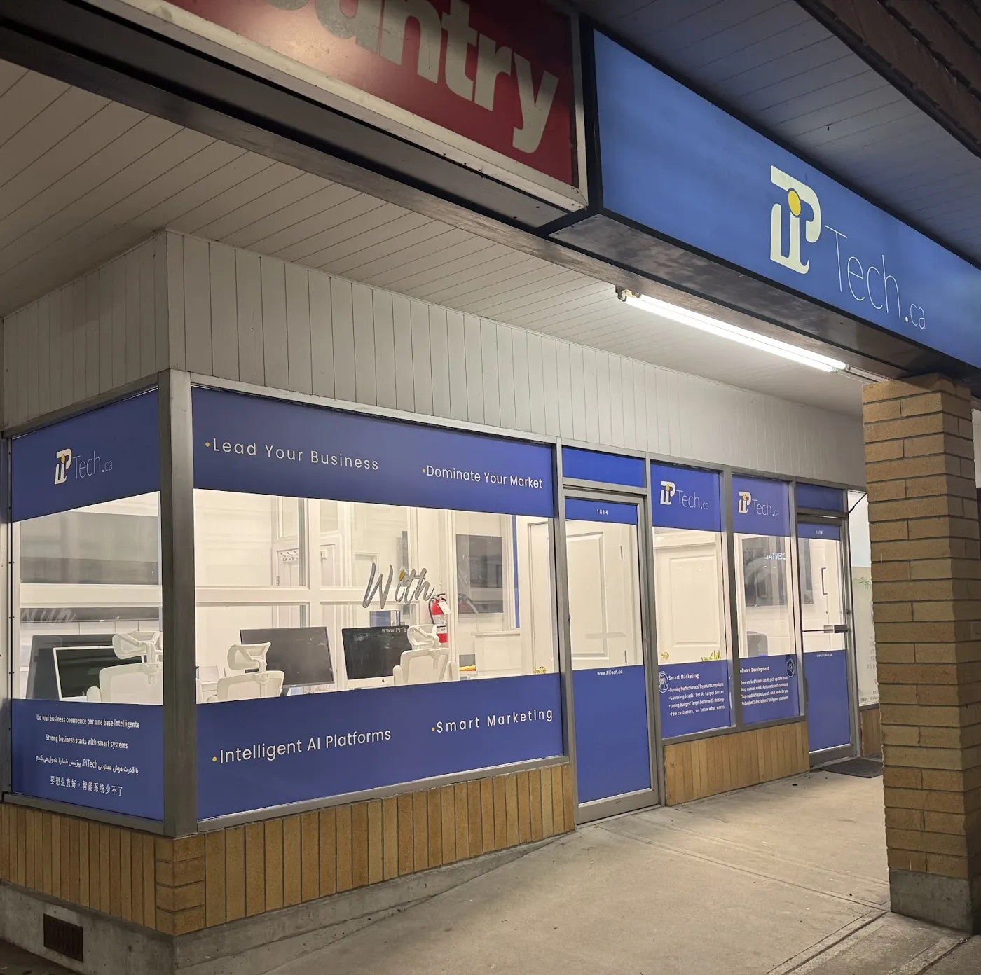 PiTech branded storefront at 1814 Marine Drive in West Vancouver with blue window graphics and PiTech signage