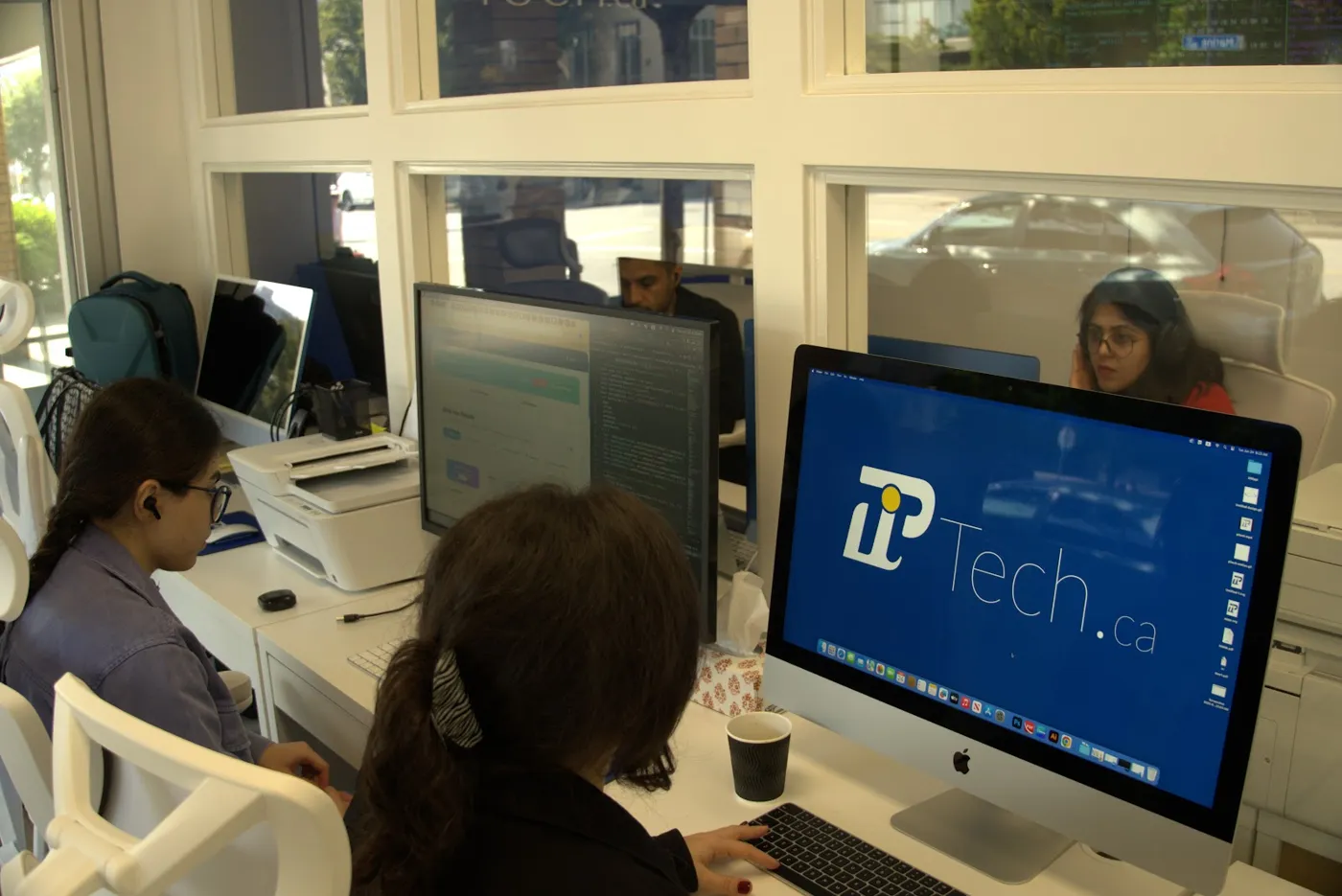 PiTech team working on client platforms at 1814 Marine Drive